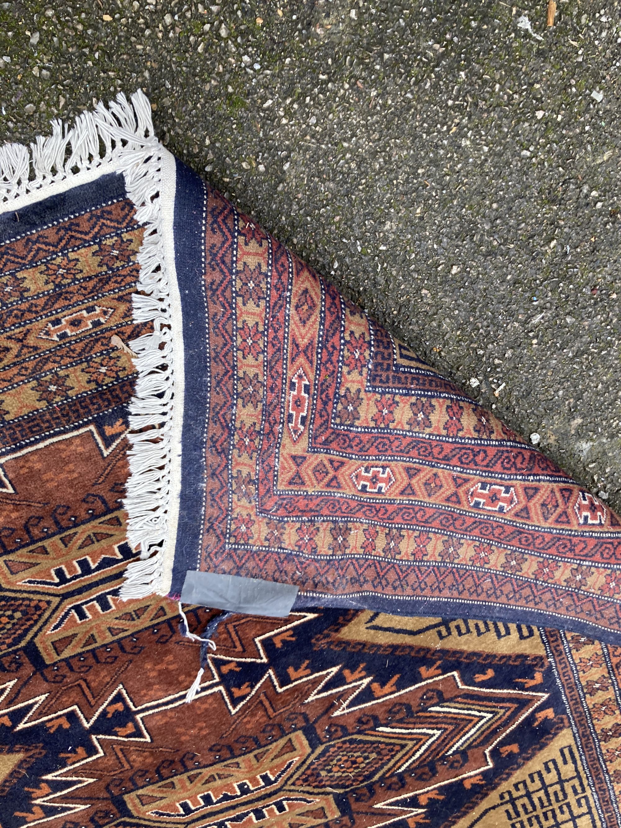 A Caucasian brown ground carpet, 280 x 190cm